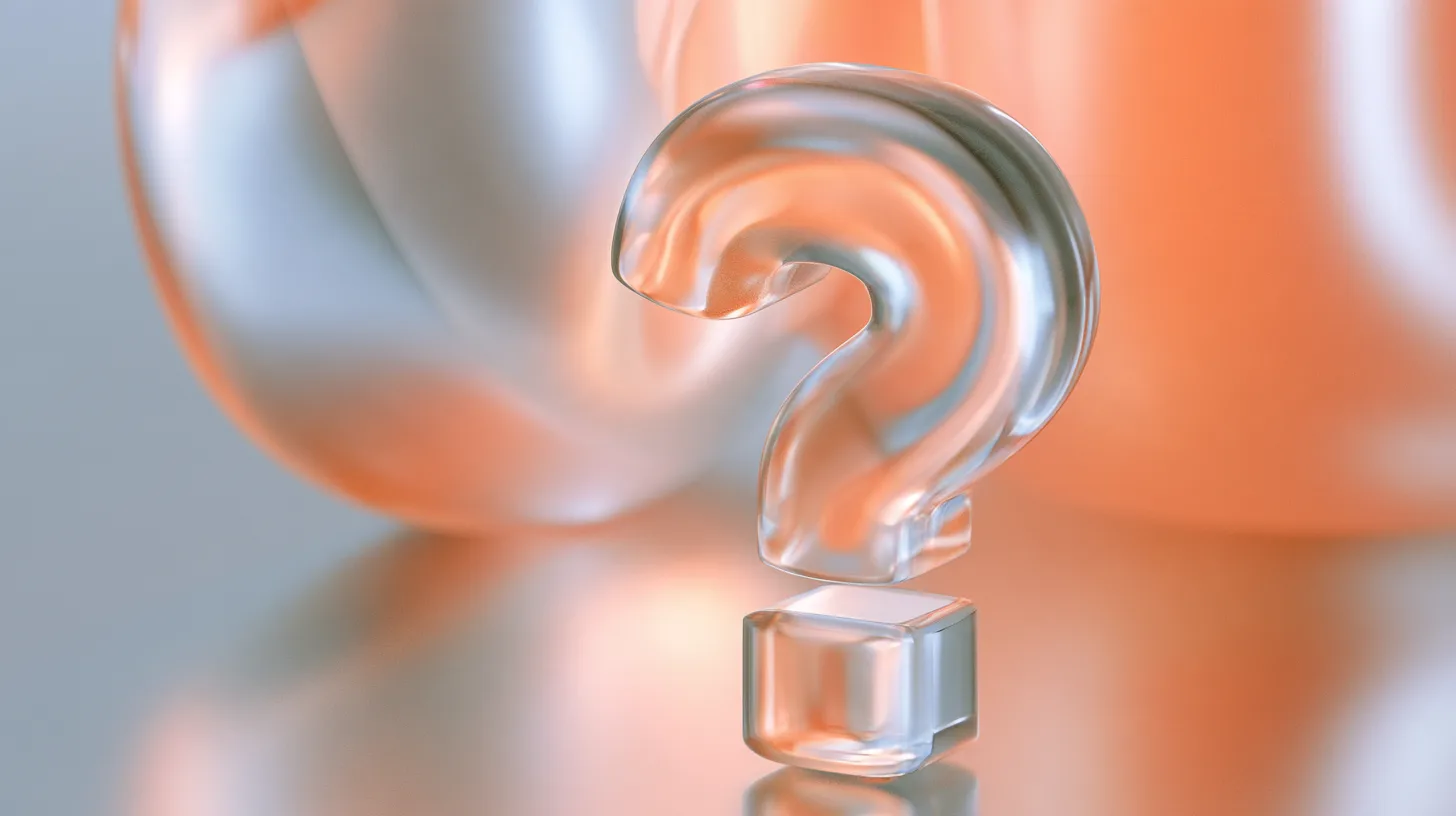 A translucent glass question mark standing on a reflective surface, lit orange and silver.